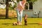 Woman playing pinscher ratter dog outside