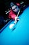 Woman playing pool