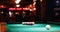 Woman playing snooker in night club 4k