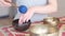 Woman playing on Tibetan singing bowl while sitting on yoga mat. Vintage tonned. stock footage. Slow Motion video. Close