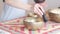 Woman playing on Tibetan singing bowl while sitting on yoga mat. Vintage tonned. stock footage. Slow Motion video. Close