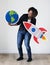 Woman playing with travel icons