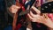 A woman plays the balalaika. Close up.