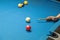 Woman plays billiard