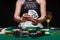 A woman plays in a casino. shows a winning combination on cards. Winning poker