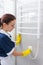 Woman plugging in heated towel rack