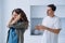 Woman plugs ears not wanting to hear husband quarrel shout