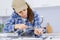 Woman plumber fixing sink