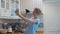 Woman with a plunger in her hands taking a selfie