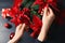 Woman with poinsettia traditional Christmas flower