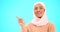 Woman, pointing finger and space for happy muslim announcement with hand for mockup. Islamic female with hijab and face