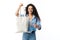 Woman Pointing Finger At Textile Bag Standing Over White Background