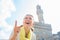 Woman pointing in front of palazzo vecchio, Italy