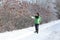 Woman pointing to Ice on Sumac Bush