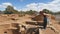 Woman Points at Something in a Kiva