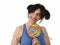 woman with ponytails biting her lips holding and licking sweet caramel big lollipop