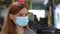 Woman with poor health and coughing medical mask and gloves observing modern safety precautions in public places while