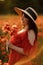 Woman poppy field red dress hat. Happy woman in a long red dress in a beautiful large poppy field. Blond stands with her