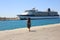Woman port meets happy tourist cruise liner