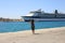 Woman port meets happy tourist cruise liner