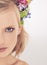 Woman, portrait and confidence with flowers on crown in studio with makeup for cosmetics and skincare. Spring aesthetic