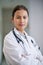 Woman, portrait and doctor with confidence in hospital, clinic and wellness facility with consultant in medical career