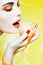 Woman Portrait eating a mandarin orange tangerine