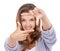 Woman, portrait and finger frame in studio to review profile picture, composition or creativity on white background