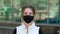 Woman portrait in mask look at camera closeup style face coronavirus covid-19 4K