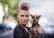 Woman, portrait and punk fashion with dog, edgy rock hairstyle and cool in funky clothes with care for pet chihuahua