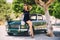 Woman pose near vintage car
