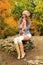 Woman posed outdoor dressed in knitted autumn outfit