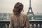 A woman poses in front of the iconic Eiffel Tower in Paris, France, Young woman\\\'s rear view looking at the Eiffel Tower, AI