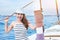 Woman posing on deck of sailboat, summer holidays