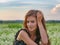 Woman posing in a field of white lavendar flowers.