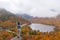 Woman posing in front of beautiful Echo Lake from Artists Bluff Loop in New Hampshire USA