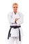 Woman posing in karate stand on white background