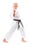 Woman posing in karate stand on white background