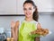 Woman posing with plate of deep-fried kroketten