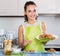 Woman posing with plate of deep-fried kroketten