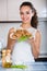 Woman posing with plate of deep-fried kroketten