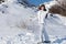 Woman Posing on Skis on Snow Covered Mountain