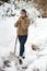 Woman posing with snow shovel