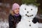 Woman posing with snowman