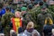 Woman posing with soldier of Spanish army with flag of Spain at hands, during His Holiness Pope Franci