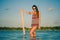 Woman posing with sunglasses in the lagoon, Laguna Bacalar, Chetumal, Quintana Roo, Mexico.