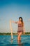 Woman posing with sunglasses in the lagoon, Laguna Bacalar, Chetumal, Quintana Roo, Mexico.