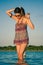 Woman posing with sunglasses in the lagoon, Laguna Bacalar, Chetumal, Quintana Roo, Mexico.