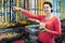 Woman posing to photographer picking different candies