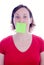 Woman post-it on her mouth